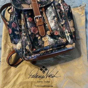 Beautiful condition Patricia Nash back back purse with cover.